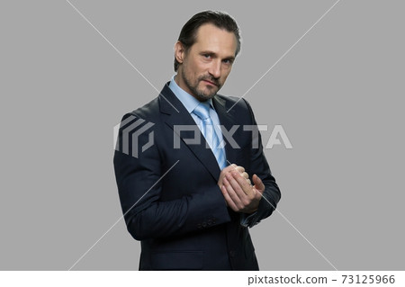 Aggressive mature businessman planning a revenge. Aggressive mature businessman planning a revenge. 73125966