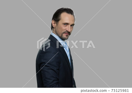 Dissatisfied businessman is expressing mistrust. Dissatisfied businessman is expressing mistrust. 73125981