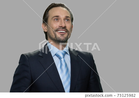Happy smiling businessman with thoughtful expression. Happy smiling businessman with thoughtful expression. 73125982