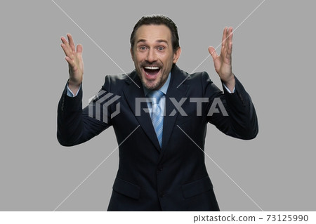 Overjoyed businessman expressing happiness. Overjoyed businessman expressing happiness. 73125990