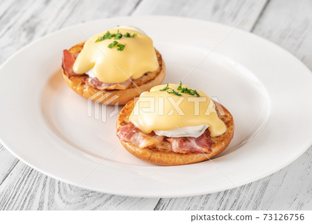 Eggs Benedict with bacon Eggs Benedict with bacon 73126756