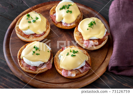 Eggs Benedict with bacon Eggs Benedict with bacon 73126759