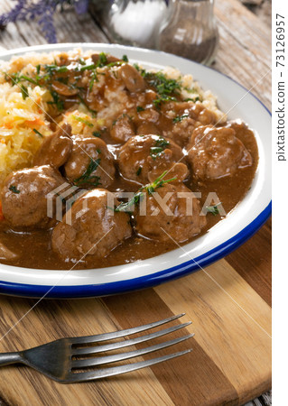 Minced meat balls in mushroom sauce. 73126957