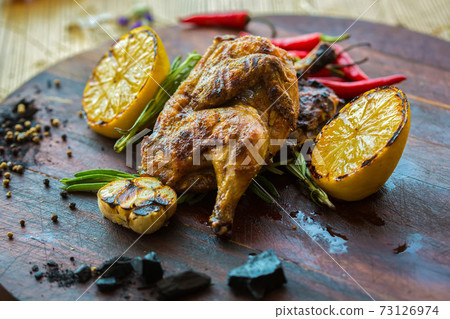 roasted chicken with lemon and herbs 73126974