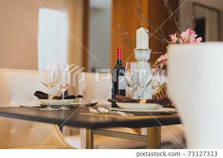 Red wine with wine glasses on the table at home. 73127313