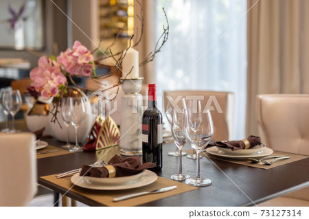Red wine with wine glasses on the table at home. 73127314