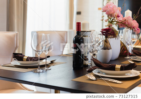 Red wine with wine glasses on the table at home. Red wine with wine glasses on the table at home. 73127315