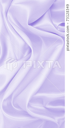Smooth elegant lilac silk or satin texture as wedding background. Luxurious background design Smooth elegant lilac silk or satin texture as wedding background. Luxurious background design 73128349