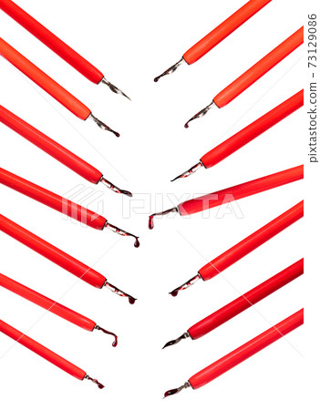 set of red dip pen holders with ink drops cut out 73129086