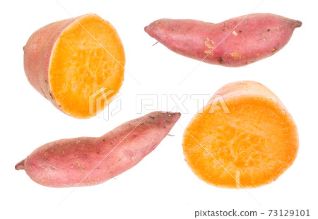 whole and halved ripe sweet potato tubers cutout 73129101
