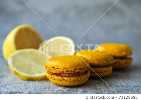 yellow lemon macaroni cookies on a gray background 73129686