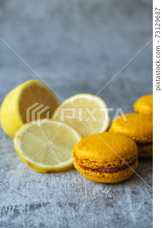 yellow lemon macaroni cookies on a gray background 73129687