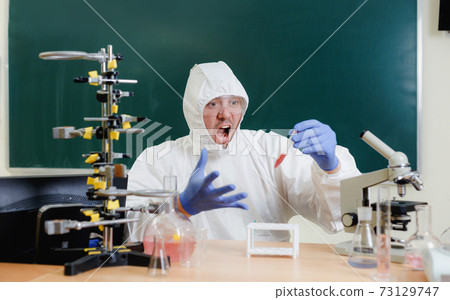 A scientist in a chemical laboratory is delighted with a successful experiment. Novichok agent chemical weapons development 73129747