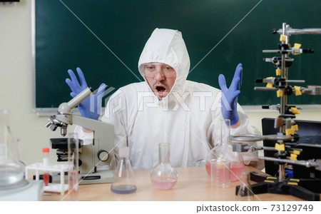 A scientist in a chemical laboratory is disappointed by a failed experiment with chemicals A scientist in a chemical laboratory is disappointed by a failed experiment with chemicals 73129749