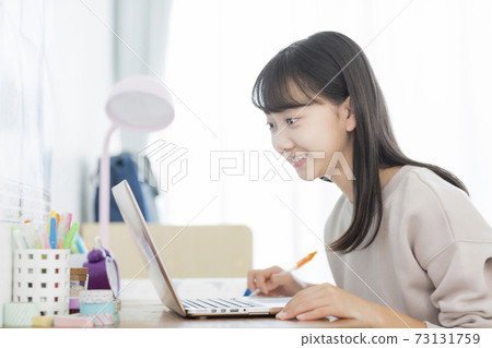 Girls studying while looking at a computer Online class Girls studying while looking at a computer Online class 73131759