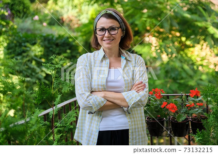 Portrait of happy middle-aged woman, confident smiling female with folded arms 73132215