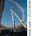 London Eye Ferris Wheel with a Blue Sky 73133686