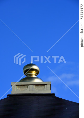 Golden jewels on the roof of the temple Golden jewels on the roof of the temple 73134472