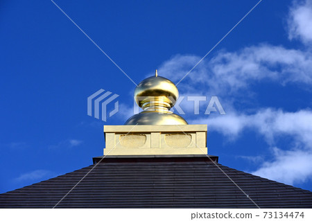 Golden jewels on the roof of the temple Golden jewels on the roof of the temple 73134474
