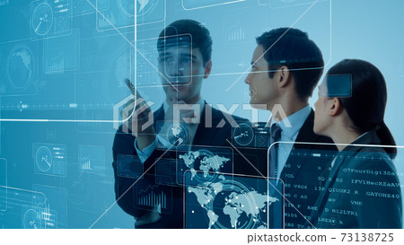 People looking at the hologram screen 73138725