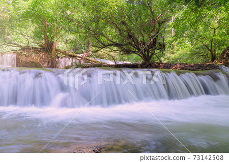 Waterfall in deep rain forest jungle (Thung Nang Khruan Waterfall) Thailand Waterfall in deep rain forest jungle (Thung Nang Khruan Waterfall) Thailand 73142508