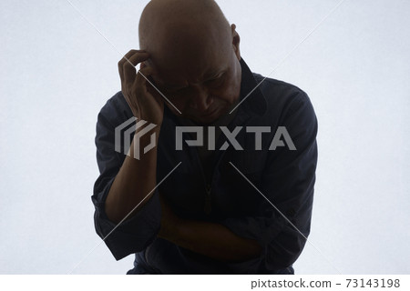 Silhouette of a troubled senior Silhouette of a troubled senior 73143198