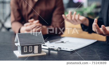 Real estate agent or sales manager has offered home sales and explained the terms of signing the house purchase contract and free home insurance, Finance and after-sales service concept. Real estate agent or sales manager has offered home sales and explained the terms of signing the house purchase contract and free home insurance, Finance and after-sales service concept. 73143699