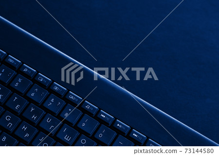 Laptop keys are tinted blue. Laptop keyboard tinted blue Laptop keys are tinted blue. Laptop keyboard tinted blue 73144580