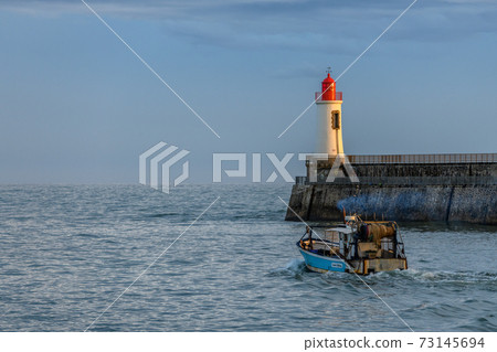 Lighthouse of grande jetee in les Sables d'Olonne in France. Lighthouse of grande jetee in les Sables d'Olonne in France. 73145694