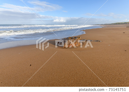 Sandy beach along the Atlantic Ocean in France. Sandy beach along the Atlantic Ocean in France. 73145751