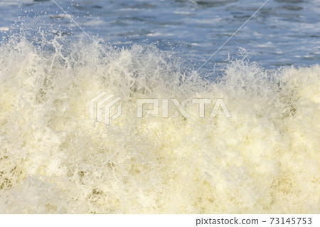 Waves breaking on the beach at the edge of the Atlantic Ocean. Waves breaking on the beach at the edge of the Atlantic Ocean. 73145753