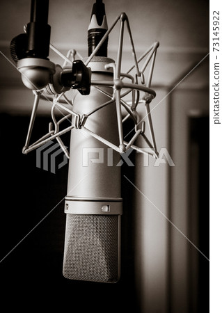 Neumann microphone in a professional audio studio. Black and white photography Neumann microphone in a professional audio studio. Black and white photography 73145922