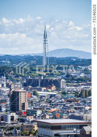 Seto Digital Tower seen in the background of mountains in the distance 73146028