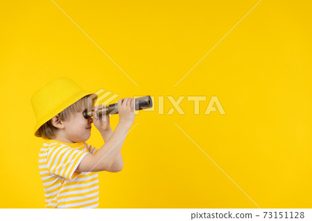 Portrait of kid wearing protective mask against yellow background 73151128
