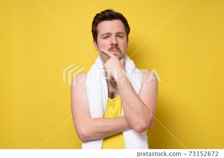 sports man thinking, feeling doubtful and confused, wondering which decision to make 73152672