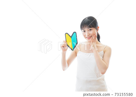 A young woman with a camisole with a beginner mark 73155580