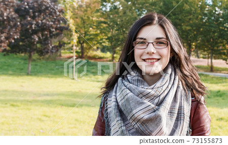 portrait of a young girl in the park in autumn portrait of a young girl in the park in autumn 73155873