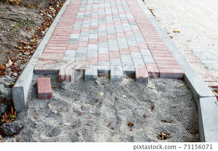 construction of a new sidewalk construction of a new sidewalk 73156071