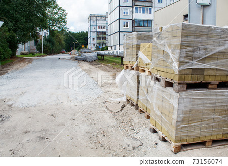 stacks of paving slabs prepared for laying 73156074