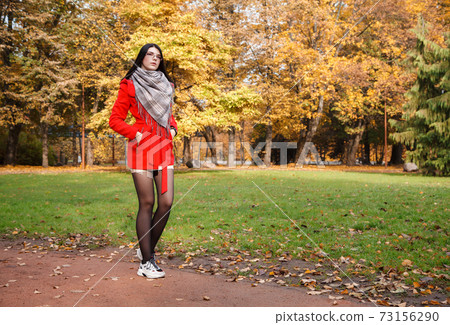 young girl in a red coat young girl in a red coat 73156290