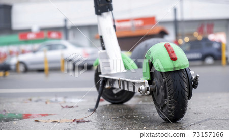 Parked electric scooter in Bucharest, Romania 73157166