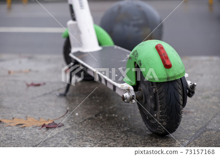 Parked electric scooter in Bucharest, Romania 73157168