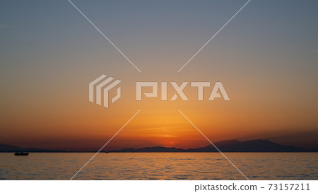 Sunset on the Aegean sea coast in Greece Sunset on the Aegean sea coast in Greece 73157211