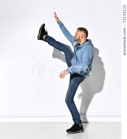 Jumping man happy excited. Funny portrait on young Jumping man happy excited. Funny portrait on young 73158115