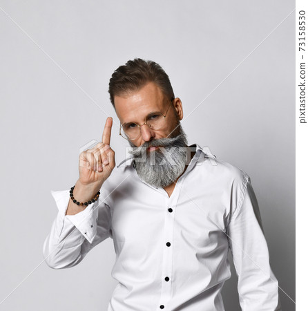 Stylish, handsome and smart hipster man who raises 73158530