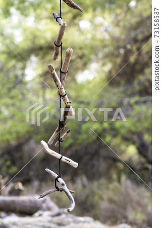 A wooden necklace on a tree in Greece 73158587