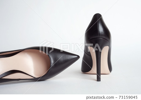 Black shoes. Black high heels on white background Black shoes. Black high heels on white background 73159045