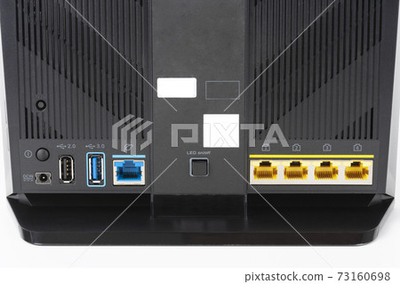 Rear view of gigabit dual-band Wi-Fi router. Wireless device with five Gigabit Ethernet ports, ultrafast USB 3.1 port and USB 2.0 port. Rear view of gigabit dual-band Wi-Fi router. Wireless device with five Gigabit Ethernet ports, ultrafast USB 3.1 port and USB 2.0 port. 73160698