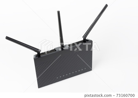 Dual-band gigabit Wi-Fi router with three antennas. Wireless device on white background. Dual-band gigabit Wi-Fi router with three antennas. Wireless device on white background. 73160700
