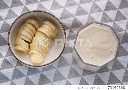 glass of milk and banana on table at morning glass of milk and banana on table at morning 73160868